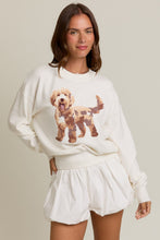 Load image into Gallery viewer, Woman wearing a white sweatshirt with a dog graphic and matching shorts on a beige background
