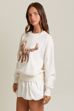 Load image into Gallery viewer, Woman wearing a white sweatshirt with a dog graphic on a plain background
