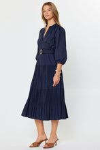 Load image into Gallery viewer, Woman wearing a navy blue midi dress with a belt on a white background
