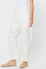 Load image into Gallery viewer, White Barrel Relaxed Fit Pants with subtle embroidered pattern worn by a person on a white background
