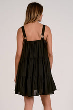 Load image into Gallery viewer, Black tiered dress worn by a model on a plain background
