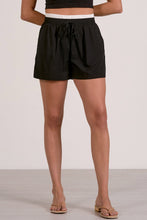 Load image into Gallery viewer, Person wearing black shorts on a plain background

