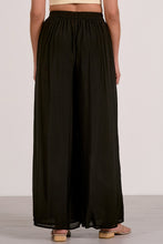Load image into Gallery viewer, Person wearing black wide-leg pants on a plain background
