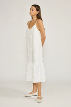 Load image into Gallery viewer, Woman wearing a white slip dress on a plain background
