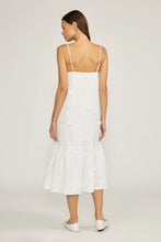 Load image into Gallery viewer, Woman wearing a white dress with thin straps on a plain background
