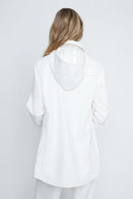 Load image into Gallery viewer, Person wearing a white oversized shirt against a plain background
