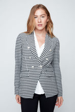 Load image into Gallery viewer, Woman wearing a black and white checkered blazer on a plain background
