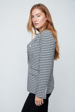 Load image into Gallery viewer, Woman wearing a black and white checkered shirt against a plain background
