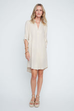 Load image into Gallery viewer, Woman wearing a golden colored dress on a white background. 3/4 length sleeves. Button down closures. 
