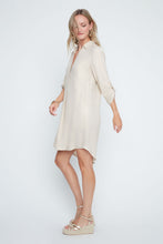 Load image into Gallery viewer, Woman wearing a golden colored dress on a white background. 3/4 length sleeves. Button down closures. 
