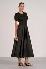 Load image into Gallery viewer, Woman wearing a black dress on a white background

