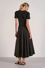 Load image into Gallery viewer, Woman wearing a black dress against a white background
