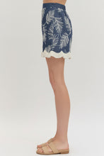 Load image into Gallery viewer, Denim skirt with white leaf pattern and beige  sandals on a plain background
