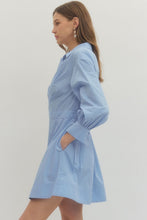 Load image into Gallery viewer, Woman wearing a French blue Mini dress with Wrap design and long sleeves on a plain background
