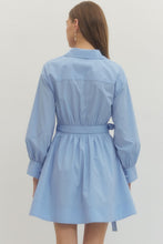 Load image into Gallery viewer, Woman wearing a French blue Mini dress with Wrap design and long sleeves on a plain background
