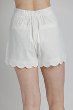 Load image into Gallery viewer, White shorts with scalloped edges on a plain background
