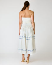 Load image into Gallery viewer, Woman wearing a white strapless dress with blue accents on a plain background
