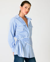 Load image into Gallery viewer, Woman wearing a blue and white striped shirt with a tie-waist design on a plain background
