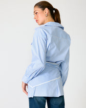 Load image into Gallery viewer, Woman wearing a blue and white striped shirt against a plain background
